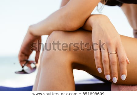 Stok fotoğraf: Closeup Of A Female Body In A Swimsuit With Sunglasses