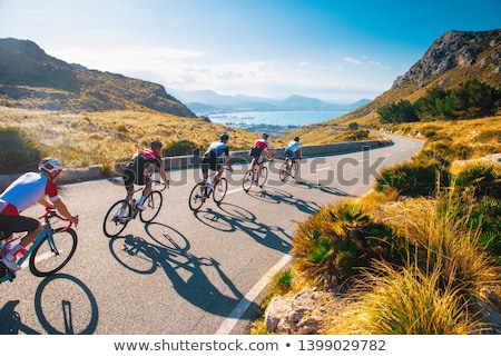 Foto stock: Cyclists In Pursuit