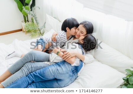 Stok fotoğraf: A Moment Of Tenderness Between Mother And Child