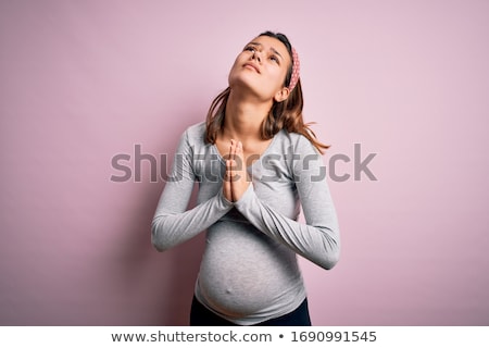 Foto stock: Young Woman Pregnant Praying Isolated On A White Background