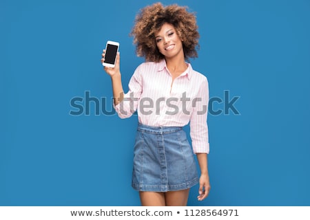 Foto stock: Young Woman In Blue Jeans And Cell Shirt
