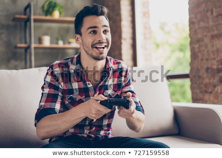 Stok fotoğraf: Close Up Of Man Playing Car Racing Video Game