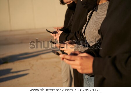 Stock photo: Group Of Four Happy Smartly Dressed Friends