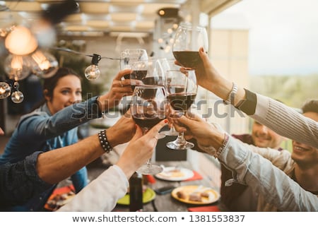 [[stock_photo]]: Friends Dining And Drinking Wine At Restaurant