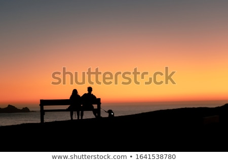 Stockfoto: Couple Sitting On A Bench