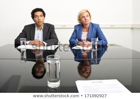 Foto stock: Two Managers Mimicking Body Language And Playing A Psychological Game During A Stern Job - Or Appra