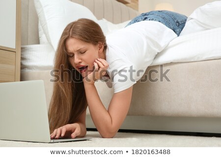 Stockfoto: Woman In Bed With Laptop