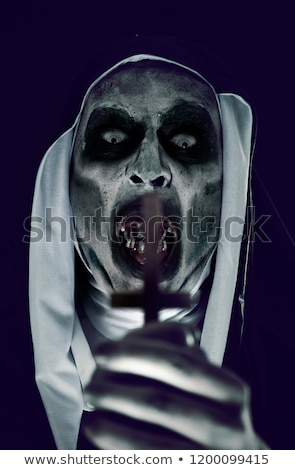 Zdjęcia stock: Frightening Evil Nun With An Upside Down Cross