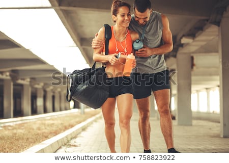 Stock photo: Young Athletic Couple In Gym On Training