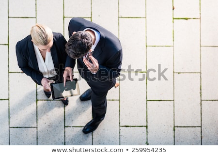 Foto stock: Businesswoman On Street With Tablet Computer