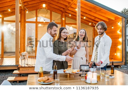 Stok fotoğraf: Fondue Dinner With Friends