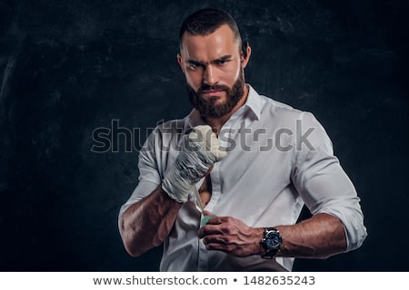[[stock_photo]]: Athletic Attractive Man Wearing Boxing Bandages On The White