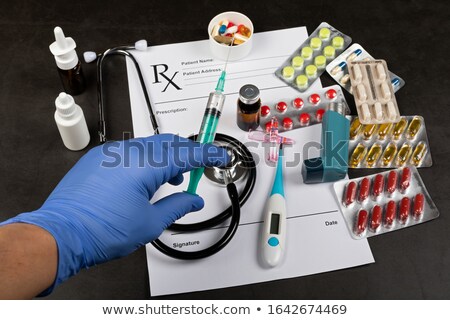 Foto stock: Hand Of A Doctor With Stethoscope Temperature Fever Flu Or Di