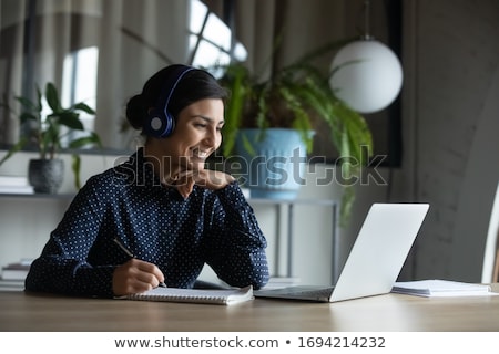 Stok fotoğraf: Young Businesswoman With Laptop Smiling