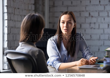 Stock photo: Young Woman In A Conversation With A Consultant Or Psychologist