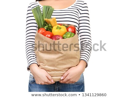 Foto stock: Young Woman Holding Spaghetti And Tomato