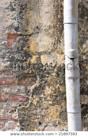 Stock photo: Peeling Paint Wall And Rusty Pipes