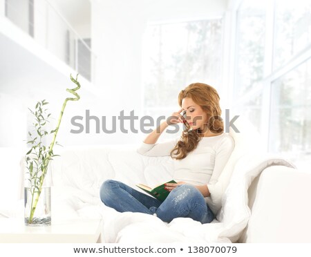 ストックフォト: Young Woman Reading Pulp Fiction Book