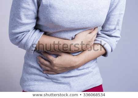 Foto stock: Woman Suffering From Stomach Pain