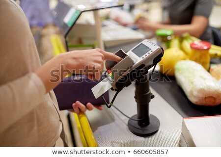 Stock fotó: Woman Entering Pin Code At Store Cash Register