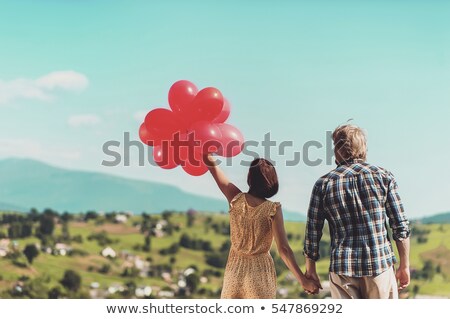 Stockfoto: Girl Outdoors Holding Red Balloon