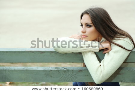 Stok fotoğraf: Worried Sad And Depressing Young Woman Sits Outside