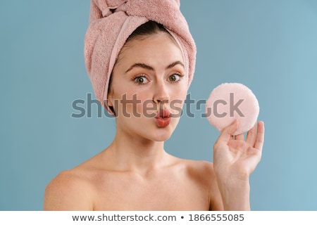 Stockfoto: Pretty Young Woman Posing Isolated Over Pink Wall Background Holding Powder Puff