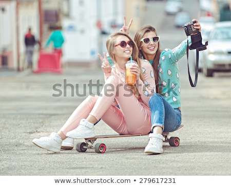 Stockfoto: Teenage Girls With Skateboards Taking Selfie