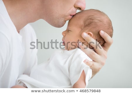 Foto stock: Close Up Of Father Little Baby Girl At Home