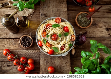 Foto stock: Italian Cuisine Ingredients Tomatoes Pasta Herbs And Spices