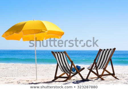 Stockfoto: Chairs And Umbrellas On Beach