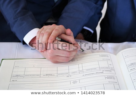 Foto stock: Close Up Of Male Gay Couple Hands And Wedding Ring