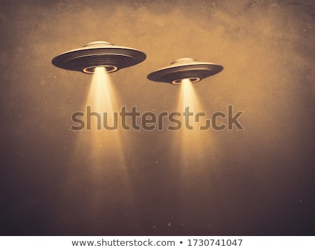 Stock photo: Alien In A Flying Saucer