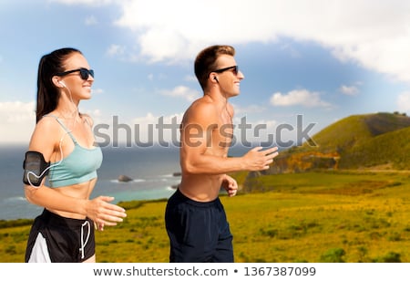 Stock fotó: Smiling Couple Running Over Big Sur Hills