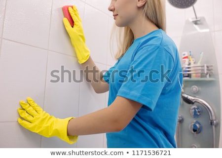 Stock foto: Crop Of Blonde Woman From Cleaning Company Cleaning Wall In White Bathroom