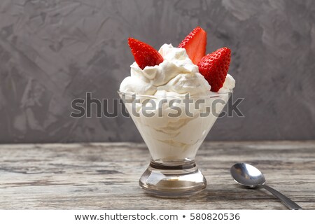 Stok fotoğraf: Dessert Of Natural Fresh Strawberry And Whipped Cream In The Shape Of A Christmas Santa Claus In A R