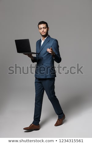 Сток-фото: Image Of Handsome Arabic Businessman 30s In Formal Suit Holding