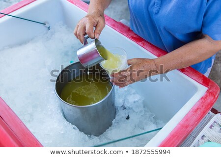 Сток-фото: Woman Drinking Sugar Cane Juice On The Asian Market