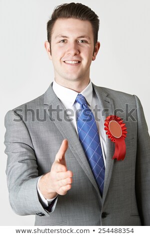 [[stock_photo]]: Portrait Of Politician Reaching Out To Shake Hands