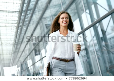 Stok fotoğraf: Young Business Woman Is Walking