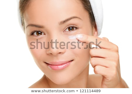 Woman Applying Under Eye Cream Stock fotó © Ariwasabi