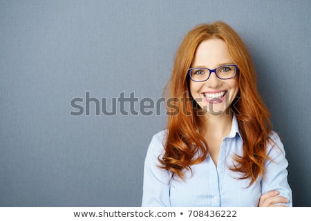 Foto stock: Pretty Woman Against A Grey Background