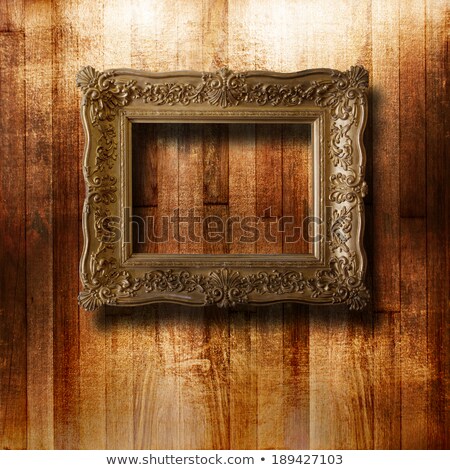 Stockfoto: Old Gilded Picture Frame For Portrait On The Scratched Wooden Wa