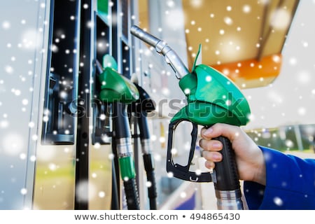 Stock photo: Car Refueling On A Petrol Station In Winter Close Up