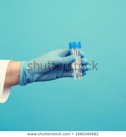 Stockfoto: Woman Doctor In Latex Gloves With Analysis Jar