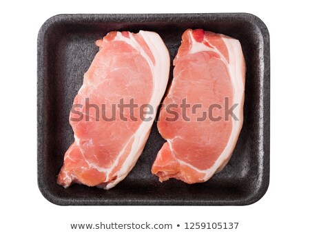 Foto stock: Raw Pork Loin Chops In Plastic Tray With Salt And Pepper And Vintage Meat Hatchets And Hammer On Rus