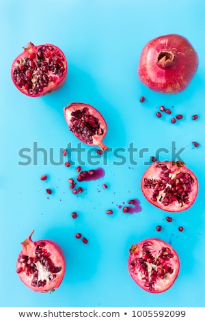 ストックフォト: Half Pomegranate Fruit On Blue Background Fresh Red Ripe