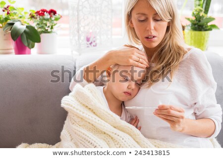 Stock fotó: Mother Checking Fever Of Her Sick Daughter