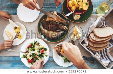 Stock fotó: Food On Table Fish And Bread On A Plate With Healthy Vegetables Ice Tea And Piece Of Bread On The