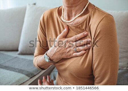 Stockfoto: Female Cardiologist Touching With Hand On Chest